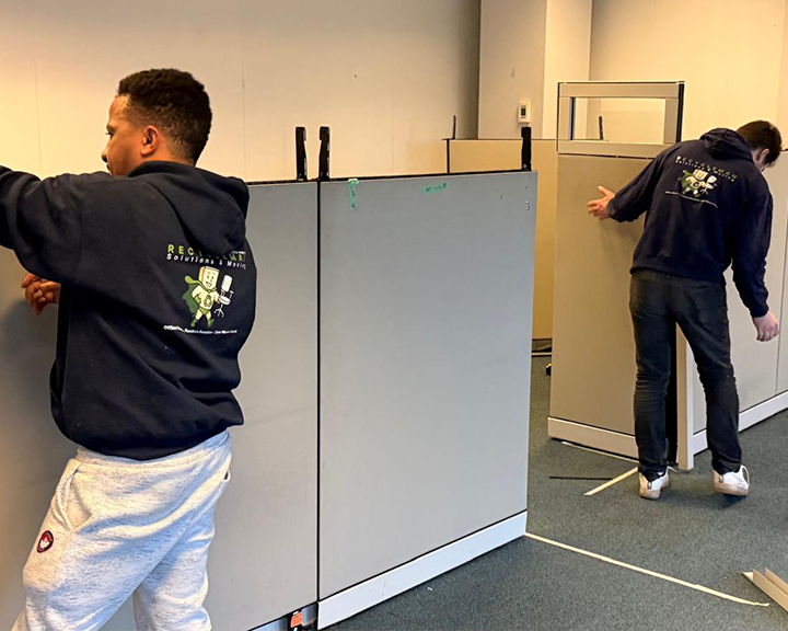 Furniture installation crew setting up a commercial office environment