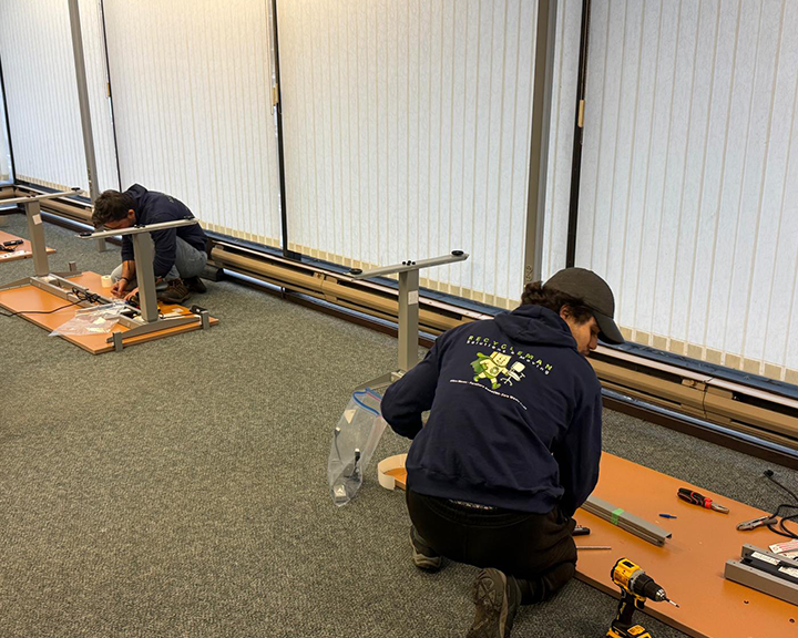 Crew preparing surplus office assets for recovery and donation