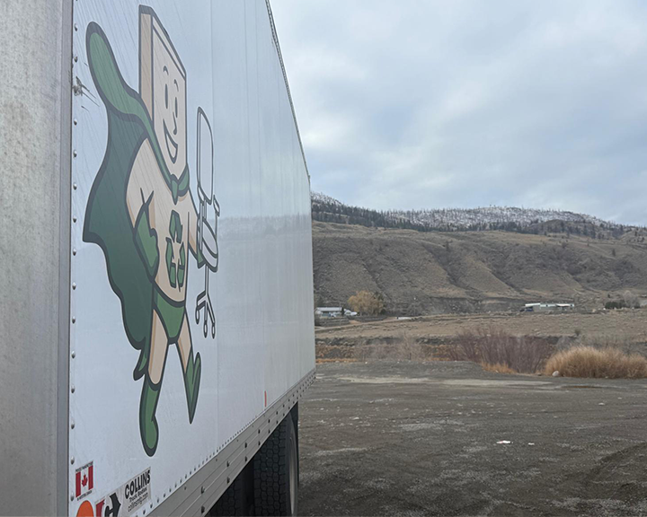 Team members handling equipment and furniture in a transition zone
