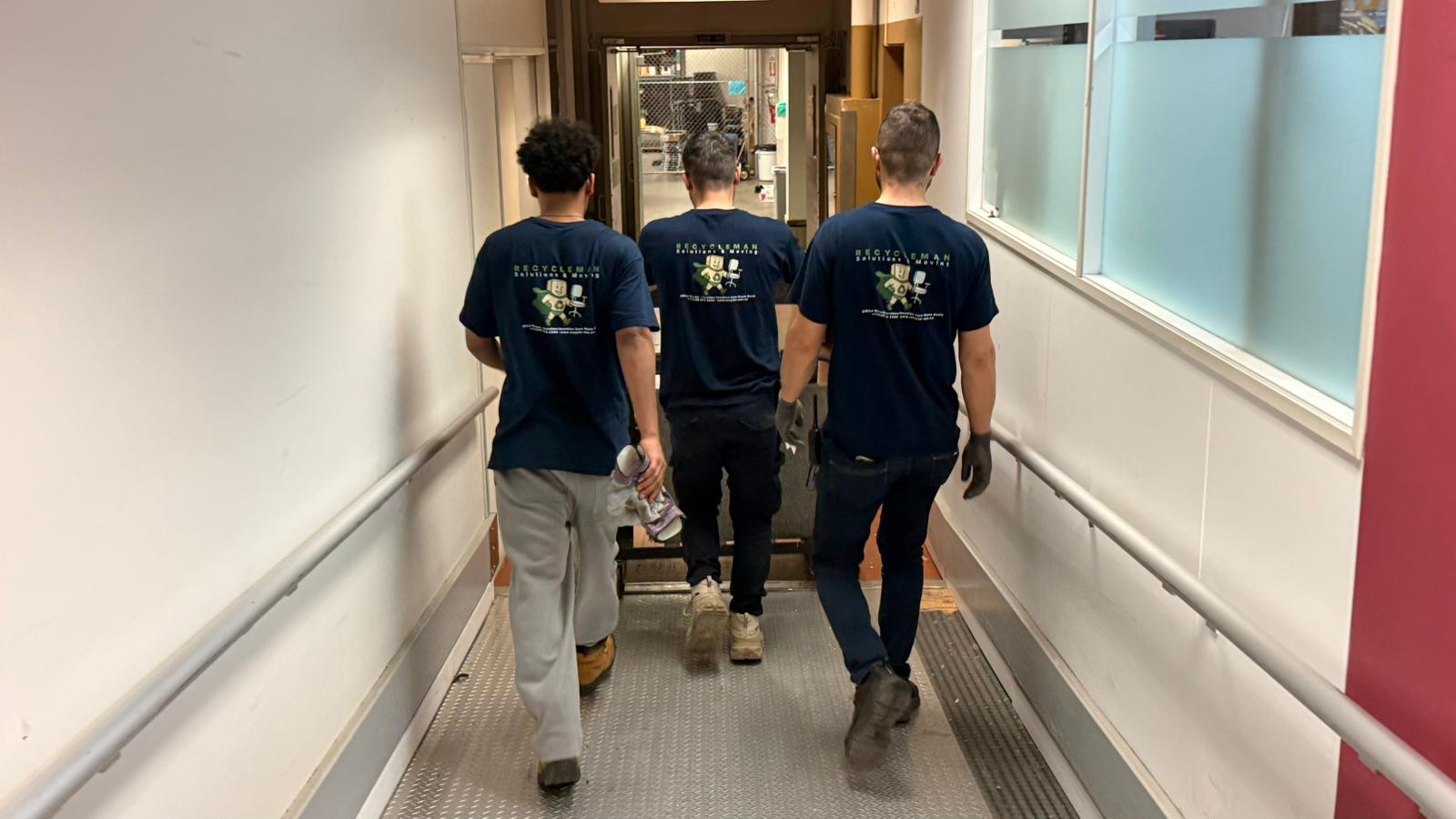 RM Workspace Solutions team in a cleared office corridor